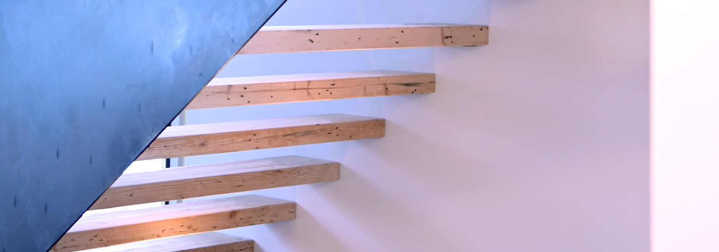 The wooden stairs at University House.