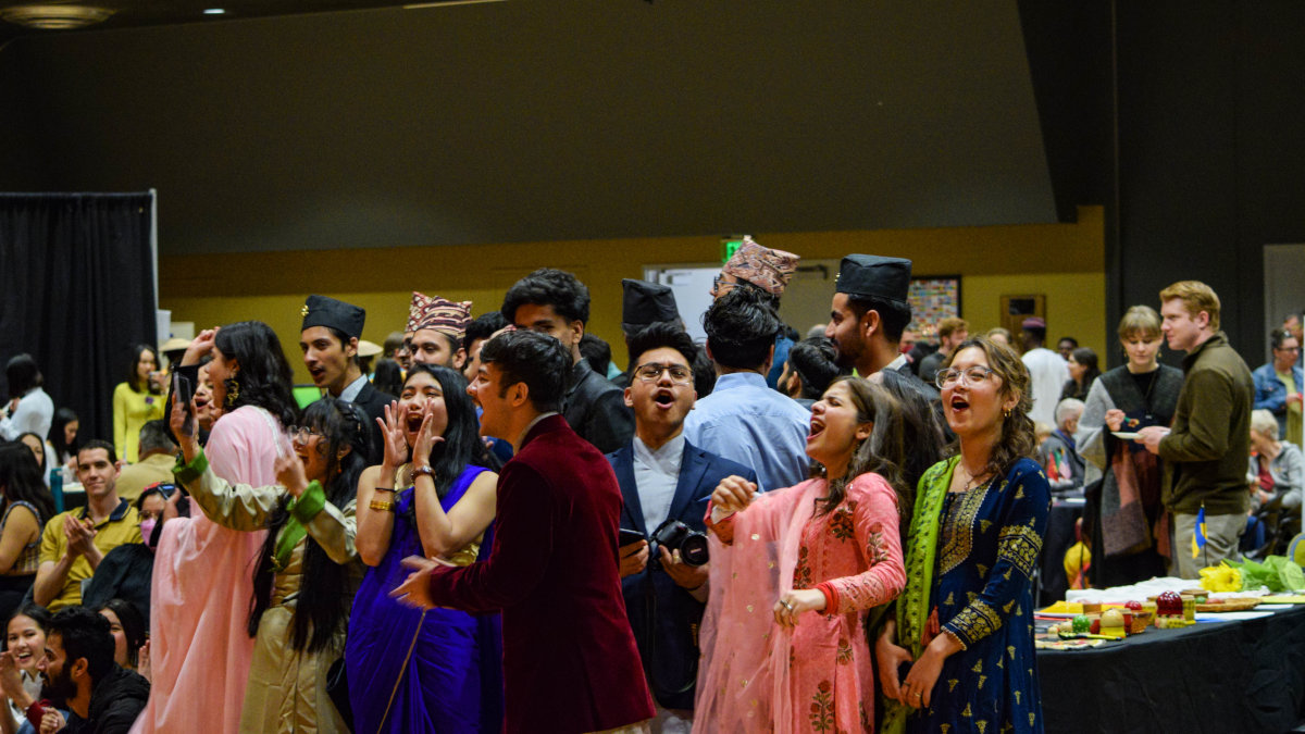 International students cheering the performers at Cruise the World 2022