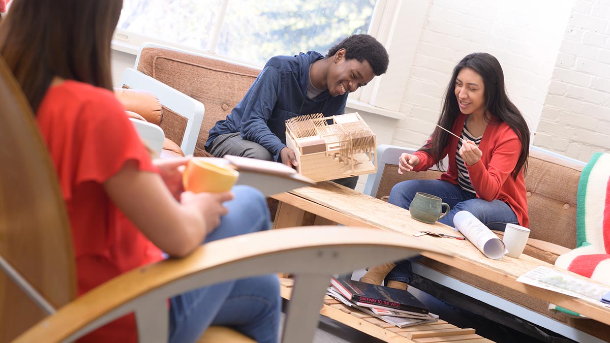 Two international students work on an architecture model