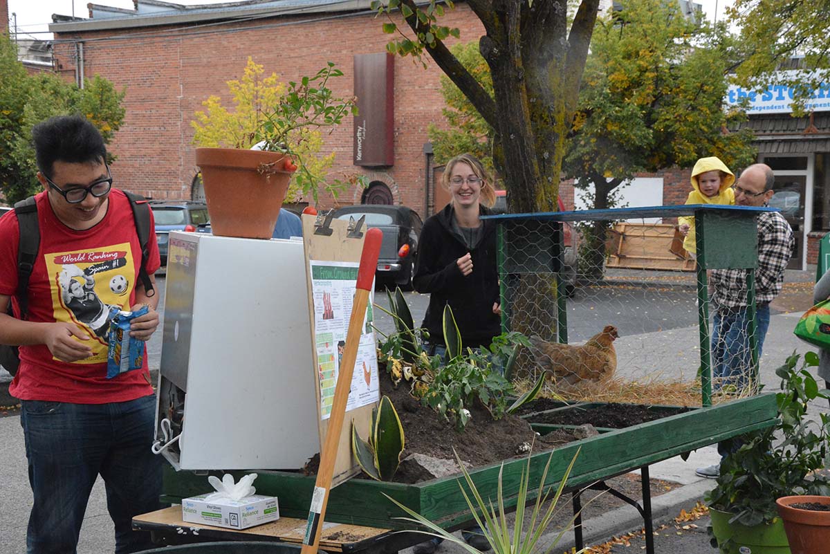 Students in community space with project