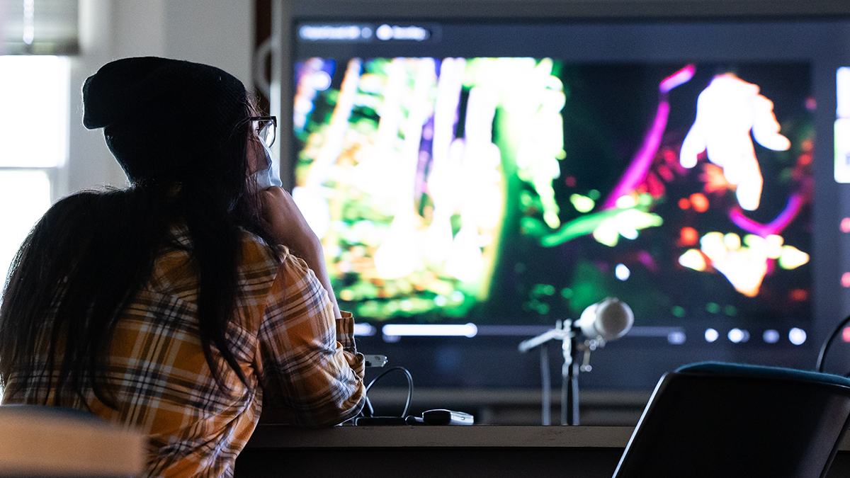 Girl watching screen with animation.