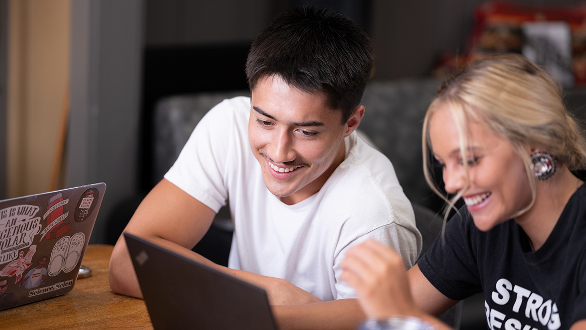 Native American students study in the library