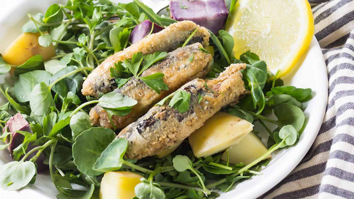 Fried fish on a bed of greens