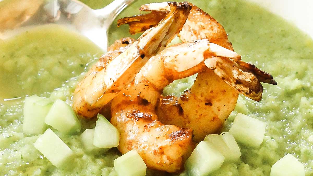 Large shrimp on a cucumber soup