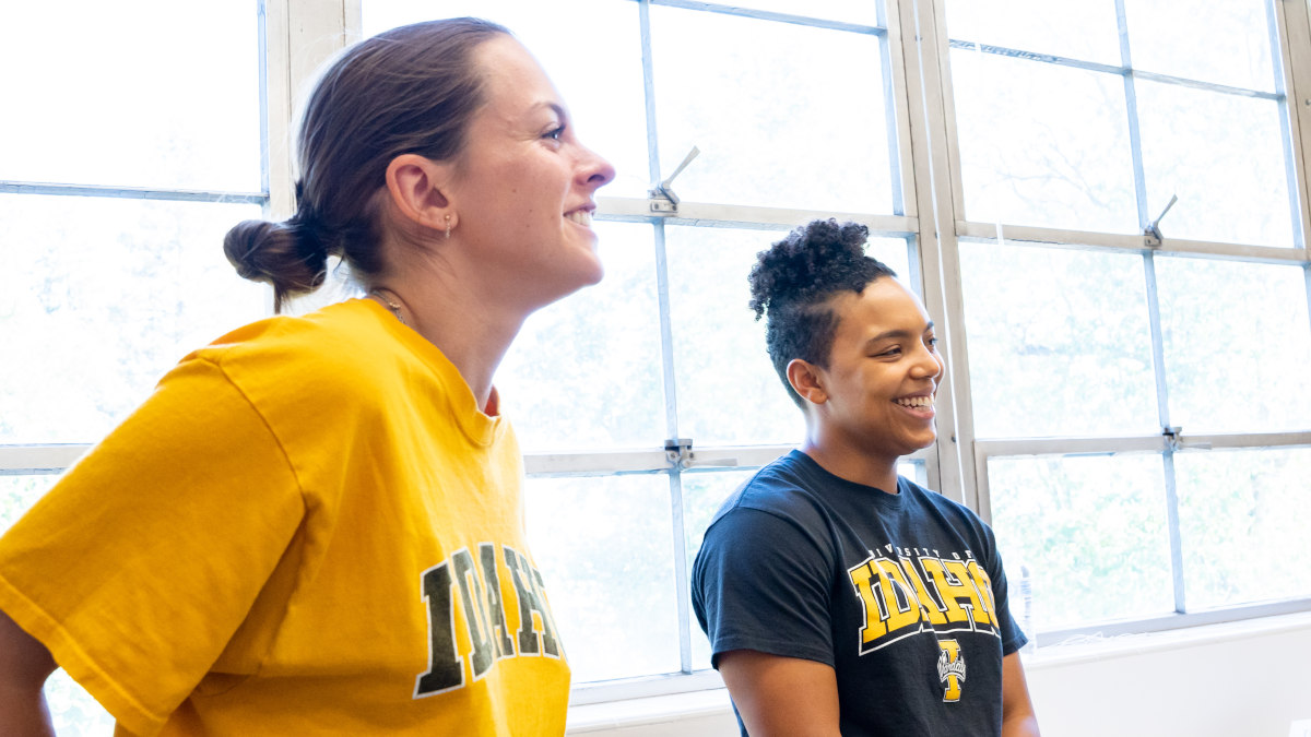 A student smiles at the camera